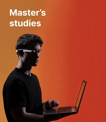 A KTU Panevėžys Faculty of Technologies and Business student working on a laptop and wearing smart glasses against an orange decorative background. The faculty offers master’s studies. Choose KTU for your master’s studies.