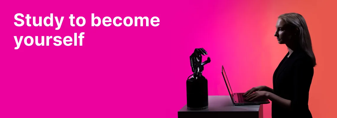 A student of the KTU Panevėžys Faculty of Technologies and Business works on a laptop next to a robotic arm against a pink and orange decorative background. On the left, the slogan “Study to become yourself” invites to choose studies at KTU Panevėžys Faculty of Technologies and Business.